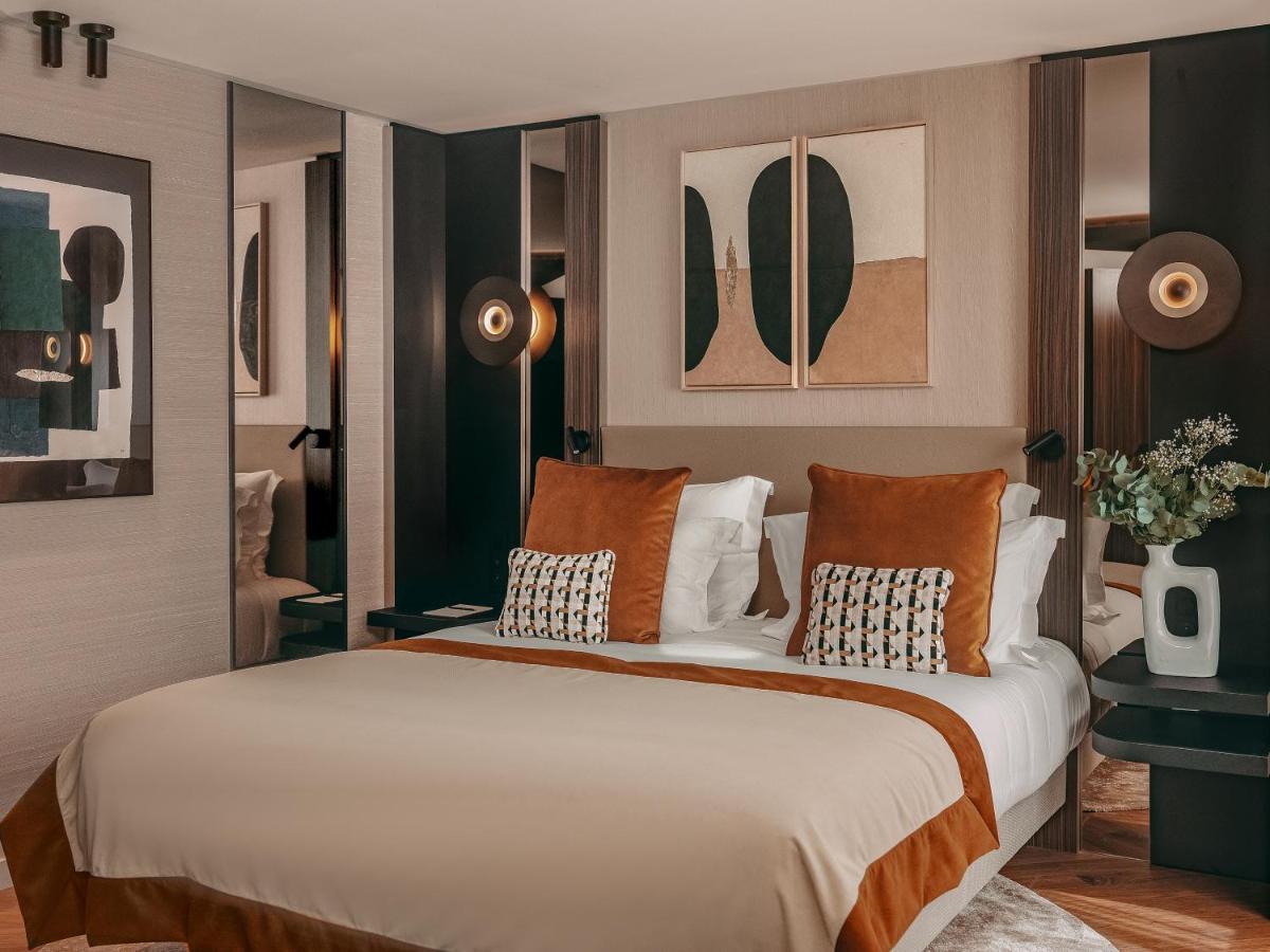 Un ou plusieurs lits dans un hébergement de l'établissement Hôtel Barnett Paris