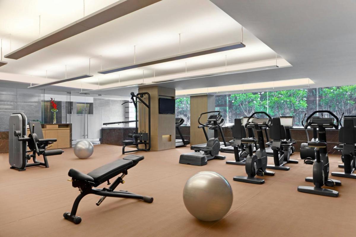 a gym with a bunch of exercise equipment in it at The Westin Gurgaon, New Delhi in Gurgaon