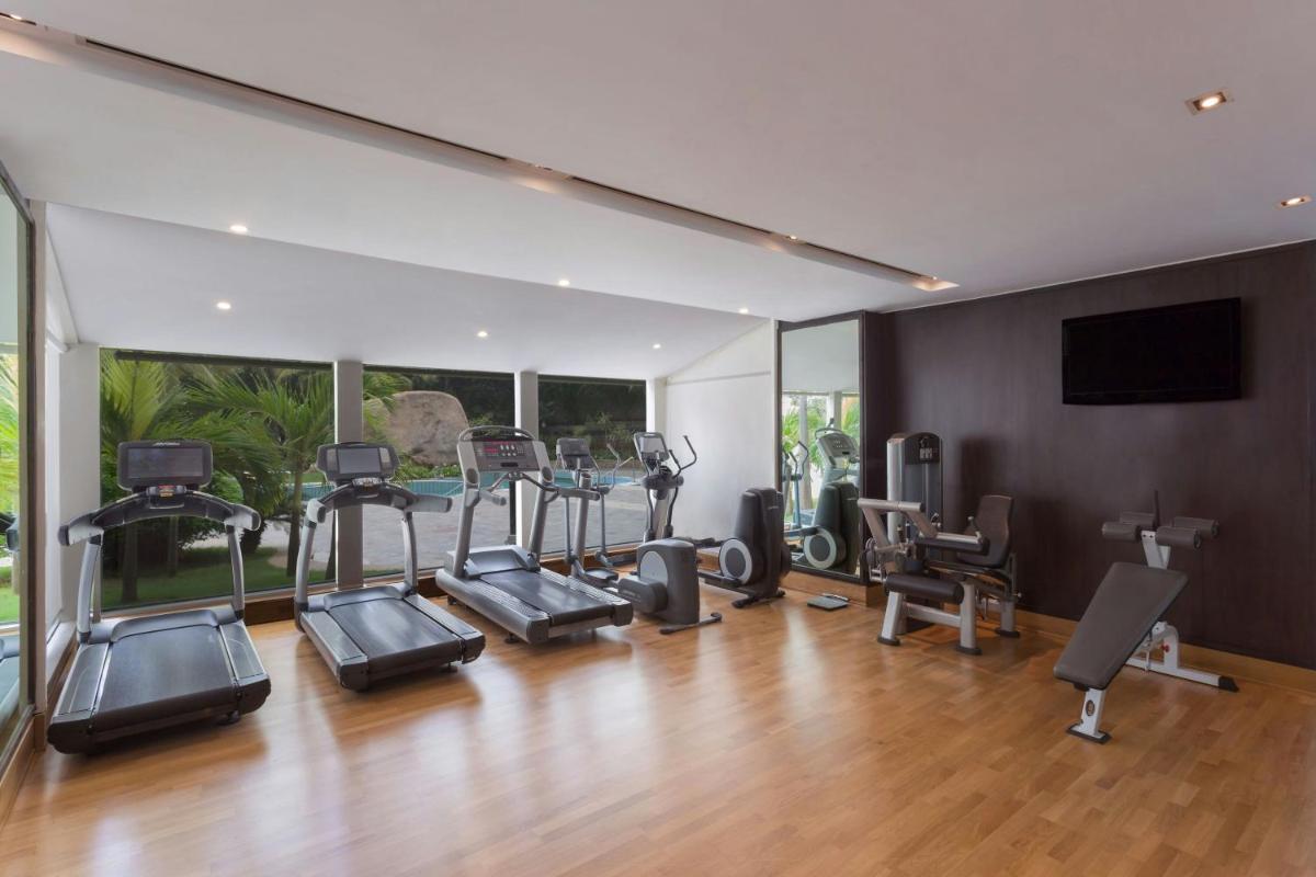 a gym with treadmills and cardio equipment in a room at ITC Kakatiya, a Luxury Collection Hotel, Hyderabad in Hyderabad