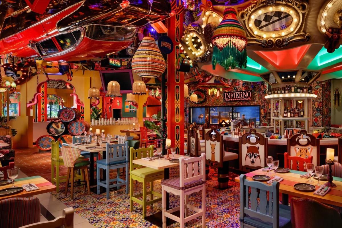 a restaurant with tables and chairs and lights at Atlantis, The Palm in Dubai a restaurant with tables and chairs and lights at Atlantis, The Palm in Dubai