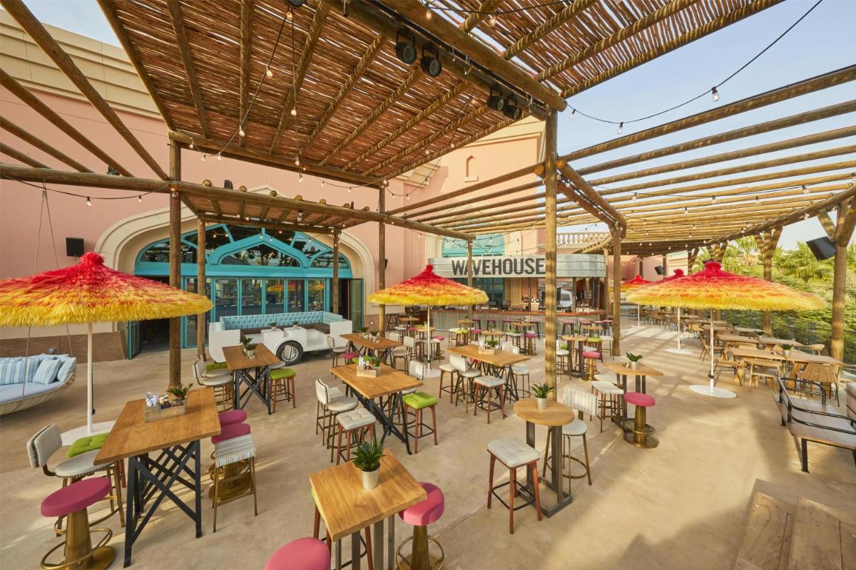an overhead view of a restaurant with tables and chairs at Atlantis, The Palm in Dubai