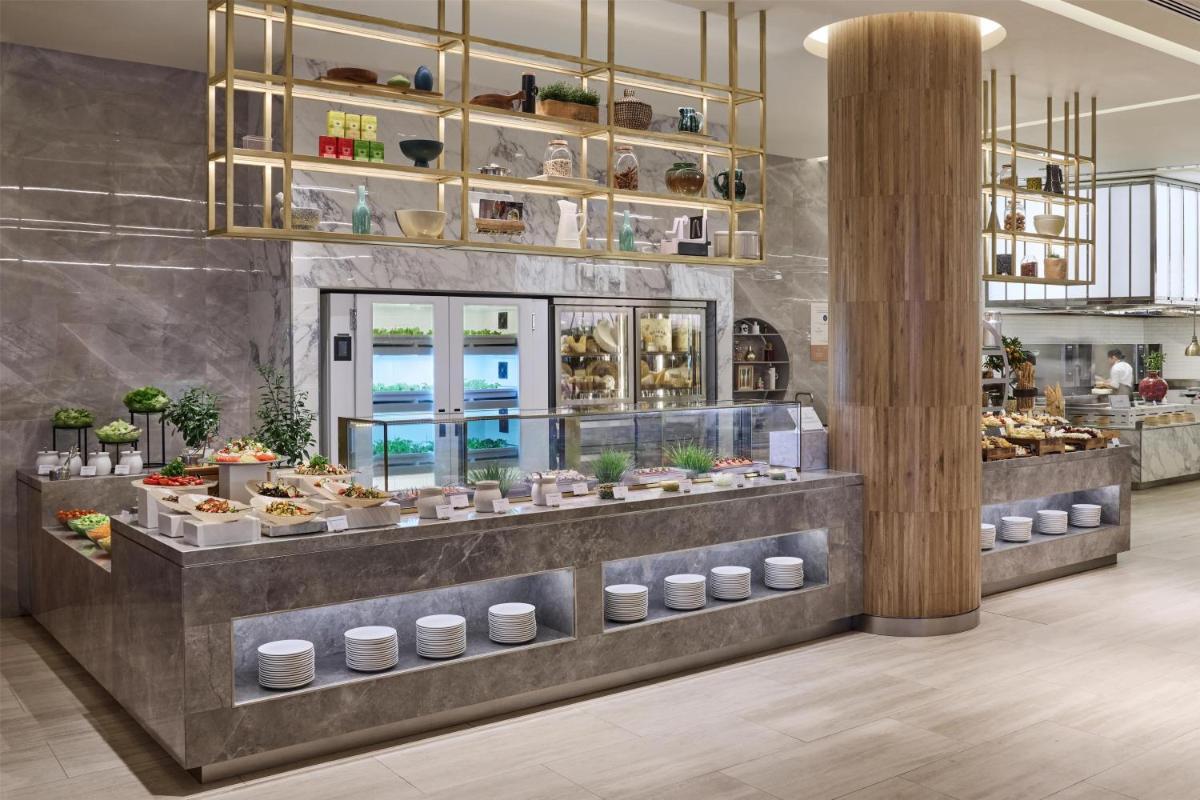 a bakery with a buffet of food on display at Atlantis, The Palm in Dubai