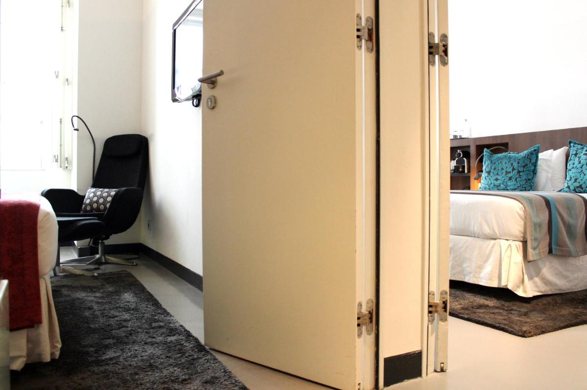 Uma cama ou camas num quarto em Inspira Liberdade Boutique Hotel
