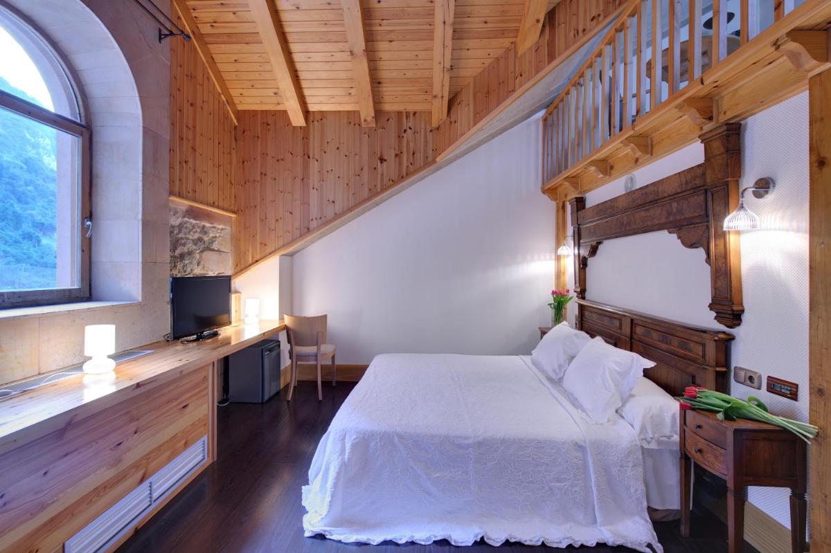 Cama o camas de una habitación en Hotel Balneario La Hermida