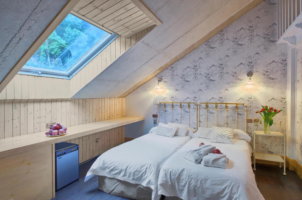 Cama o camas de una habitación en Hotel Balneario La Hermida