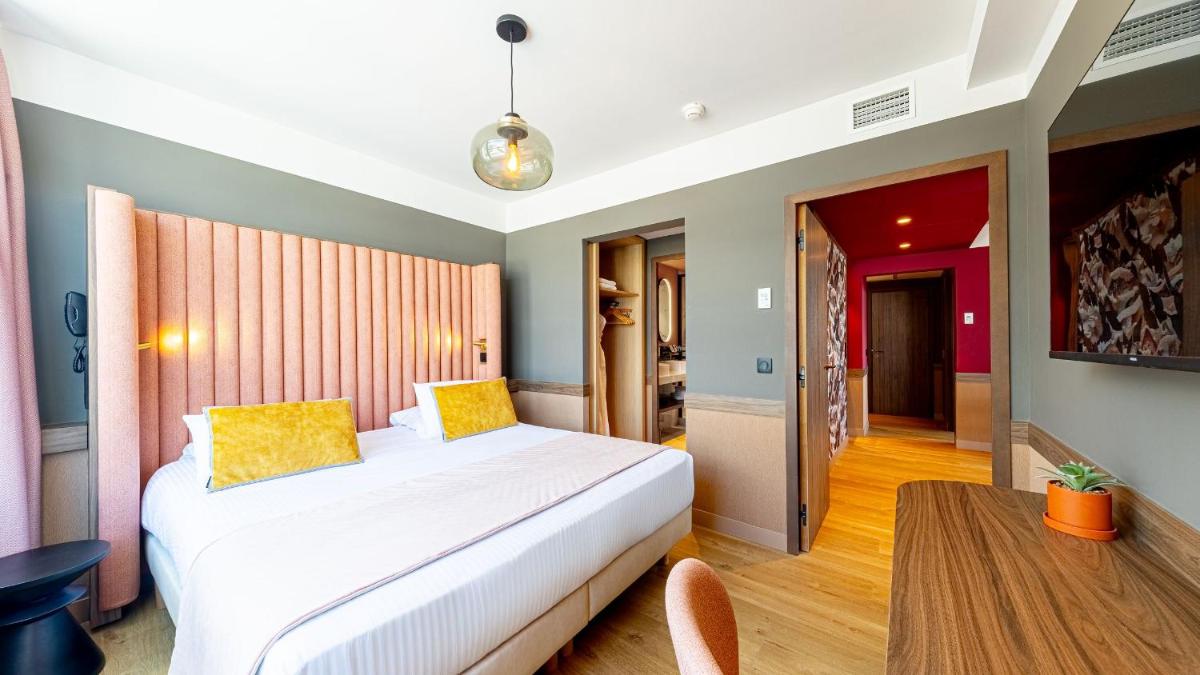 Un ou plusieurs lits dans un hébergement de l'établissement Le Riviera - Hôtel Restaurant & Spa - Ex Golden Tulip Aix les bains