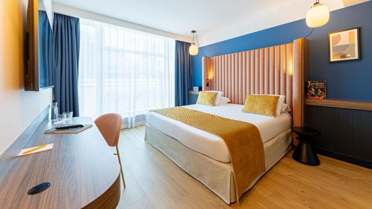Un ou plusieurs lits dans un hébergement de l'établissement Le Riviera - Hôtel Restaurant & Spa - Ex Golden Tulip Aix les bains