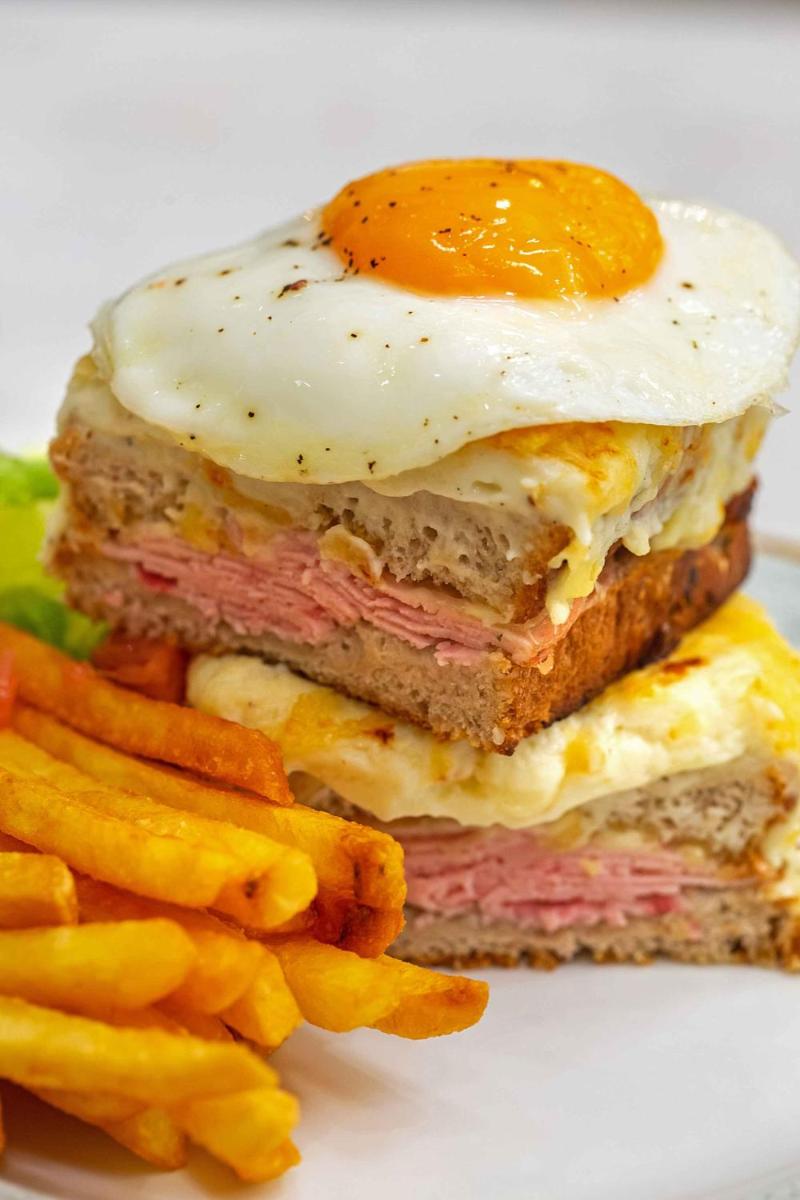 a sandwich with an egg and french fries on a plate at Hyatt Regency Jaipur Mansarovar in Jaipur a sandwich with an egg and french fries on a plate at Hyatt Regency Jaipur Mansarovar in Jaipur