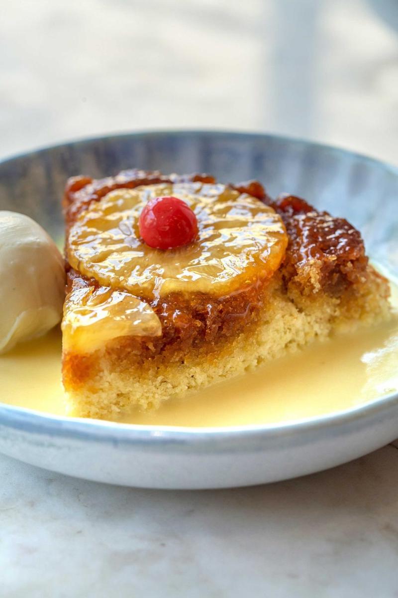 a piece of cake with a cherry on a plate at Hyatt Regency Jaipur Mansarovar in Jaipur a piece of cake with a cherry on a plate at Hyatt Regency Jaipur Mansarovar in Jaipur