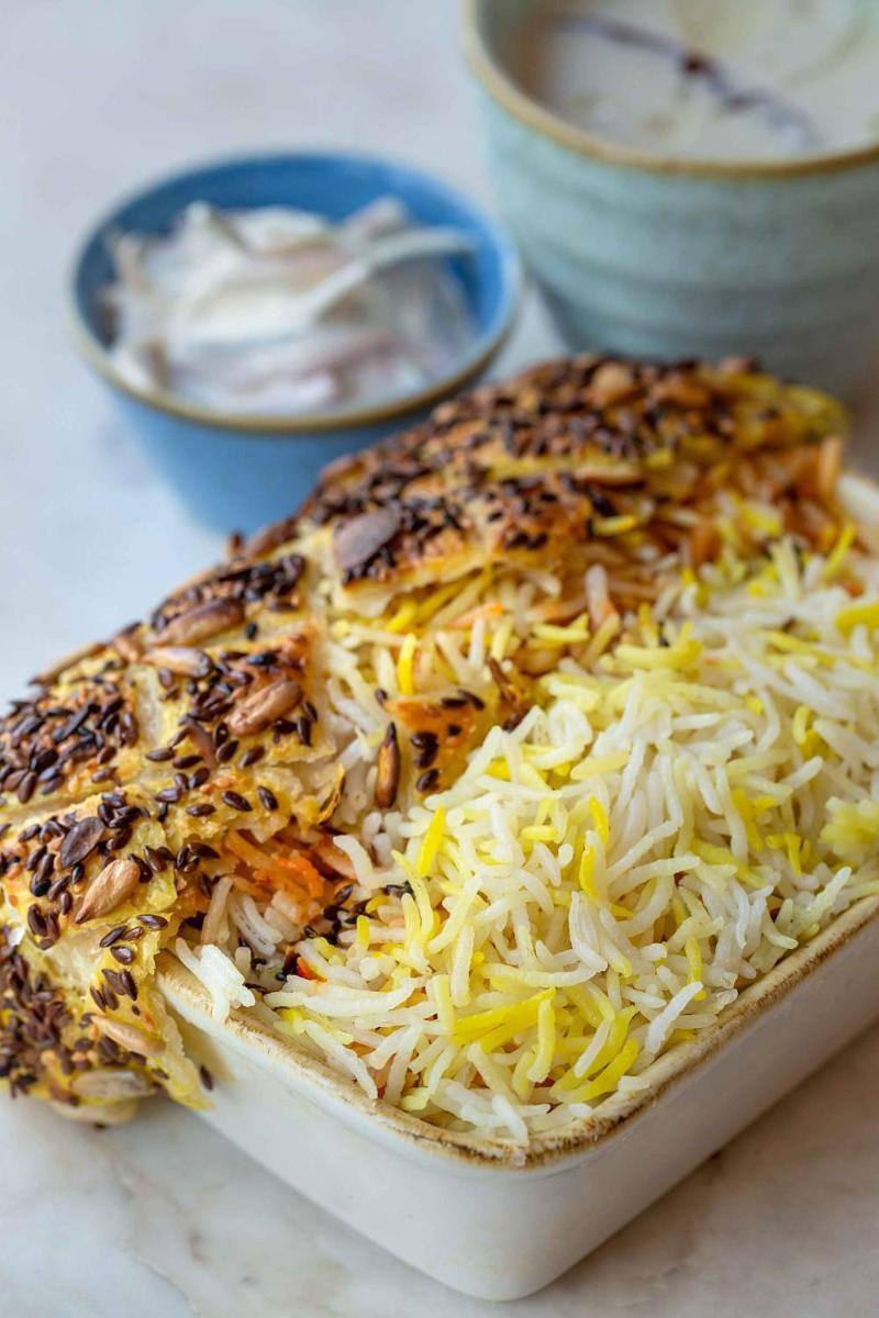 a plate of food on a table with cheese and rice at Hyatt Regency Jaipur Mansarovar in Jaipur a plate of food on a table with cheese and rice at Hyatt Regency Jaipur Mansarovar in Jaipur
