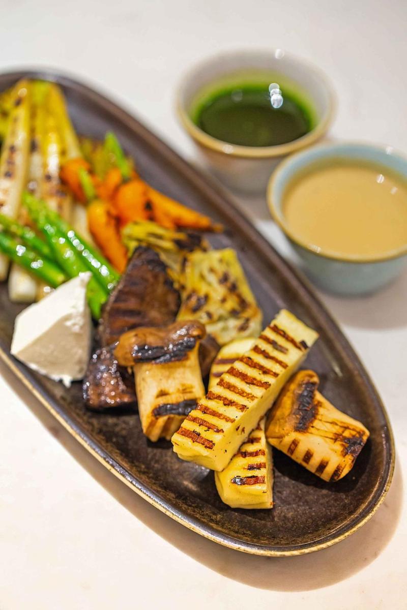 a plate of food with meat and vegetables and dipping sauce at Hyatt Regency Jaipur Mansarovar in Jaipur a plate of food with meat and vegetables and dipping sauce at Hyatt Regency Jaipur Mansarovar in Jaipur