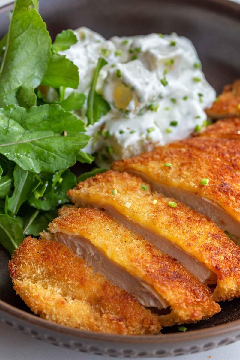 a plate of food with meat and a salad at Hyatt Regency Jaipur Mansarovar in Jaipur a plate of food with meat and a salad at Hyatt Regency Jaipur Mansarovar in Jaipur