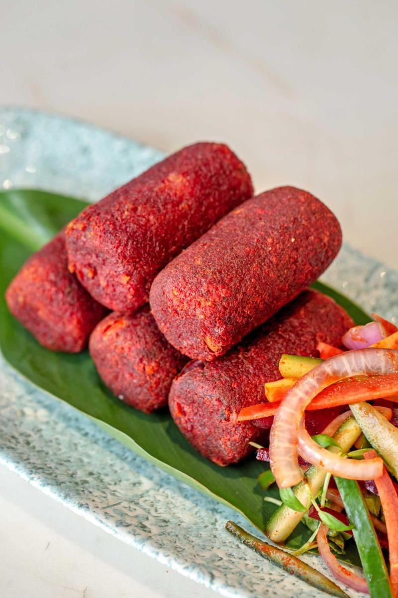 a pile of hot dogs on a green plate at Hyatt Regency Jaipur Mansarovar in Jaipur a pile of hot dogs on a green plate at Hyatt Regency Jaipur Mansarovar in Jaipur