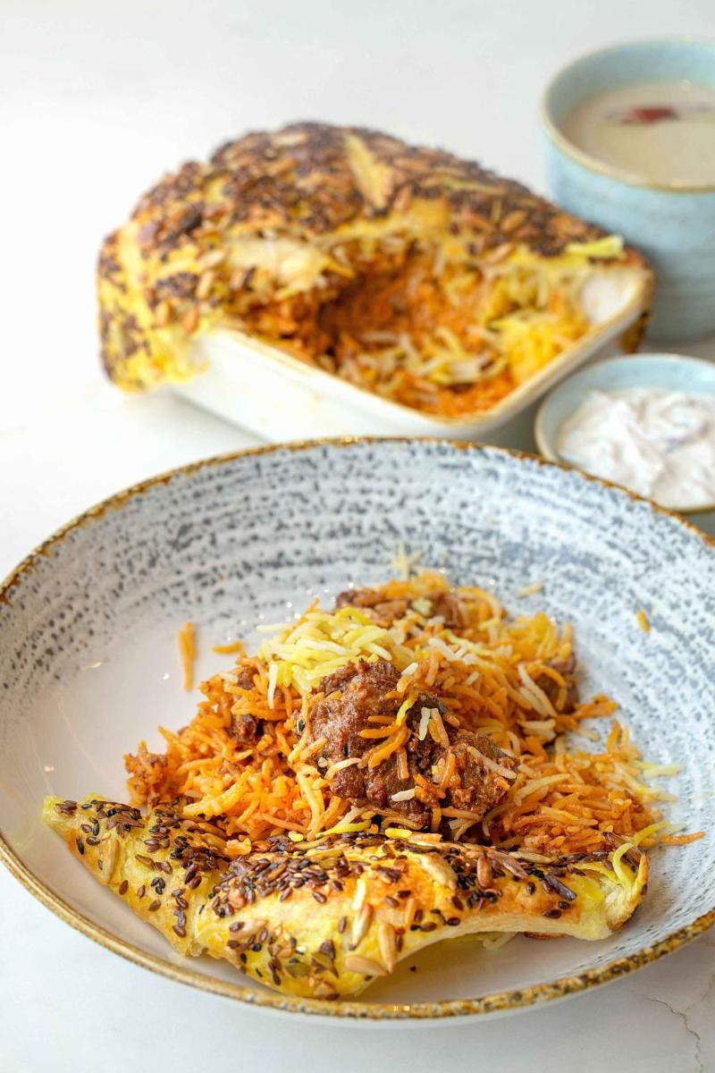 a plate of food on a table with food at Hyatt Regency Jaipur Mansarovar in Jaipur a plate of food on a table with food at Hyatt Regency Jaipur Mansarovar in Jaipur
