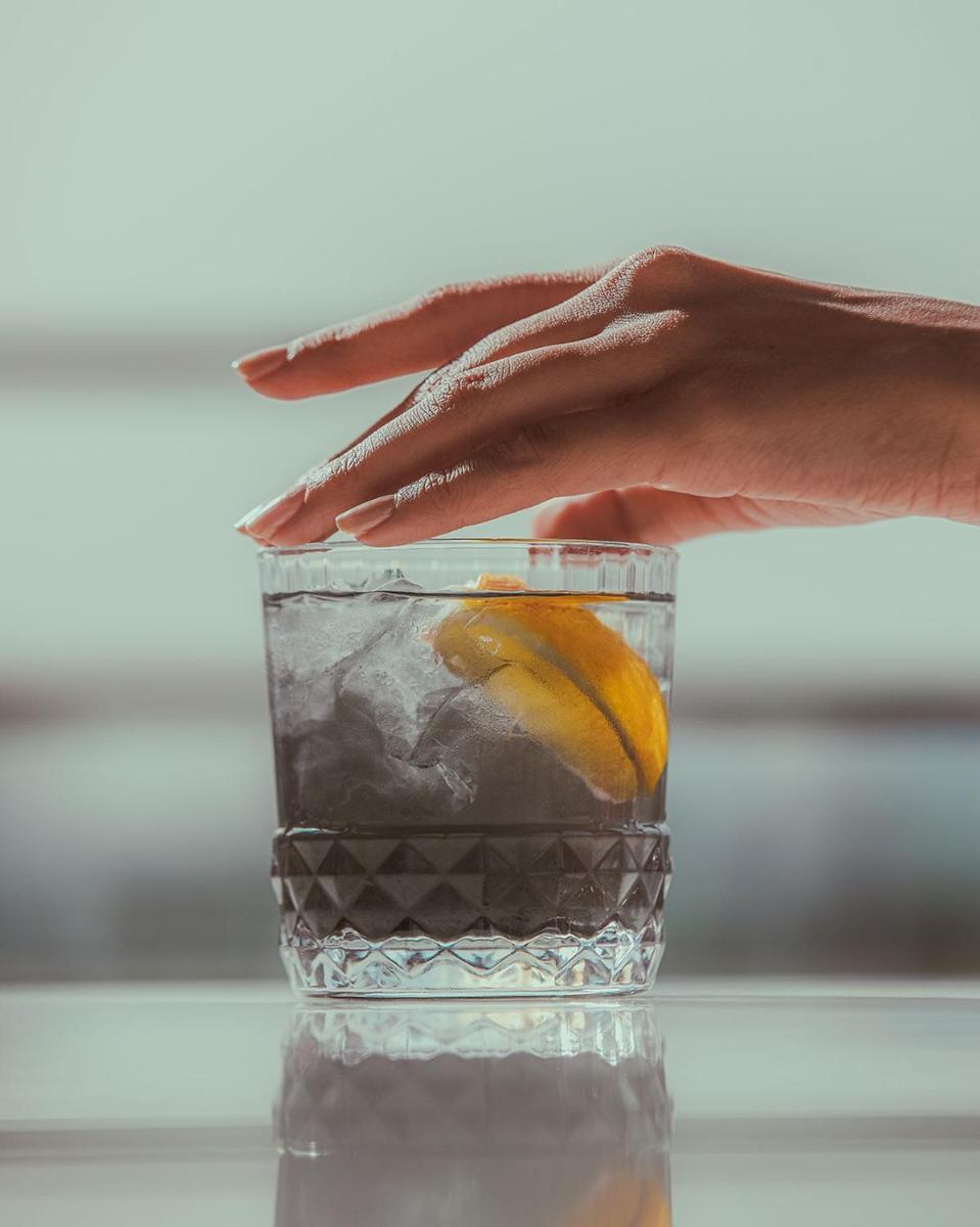 a hand holding a glass of water with a lemon at Hyatt Regency Jaipur Mansarovar in Jaipur a hand holding a glass of water with a lemon at Hyatt Regency Jaipur Mansarovar in Jaipur