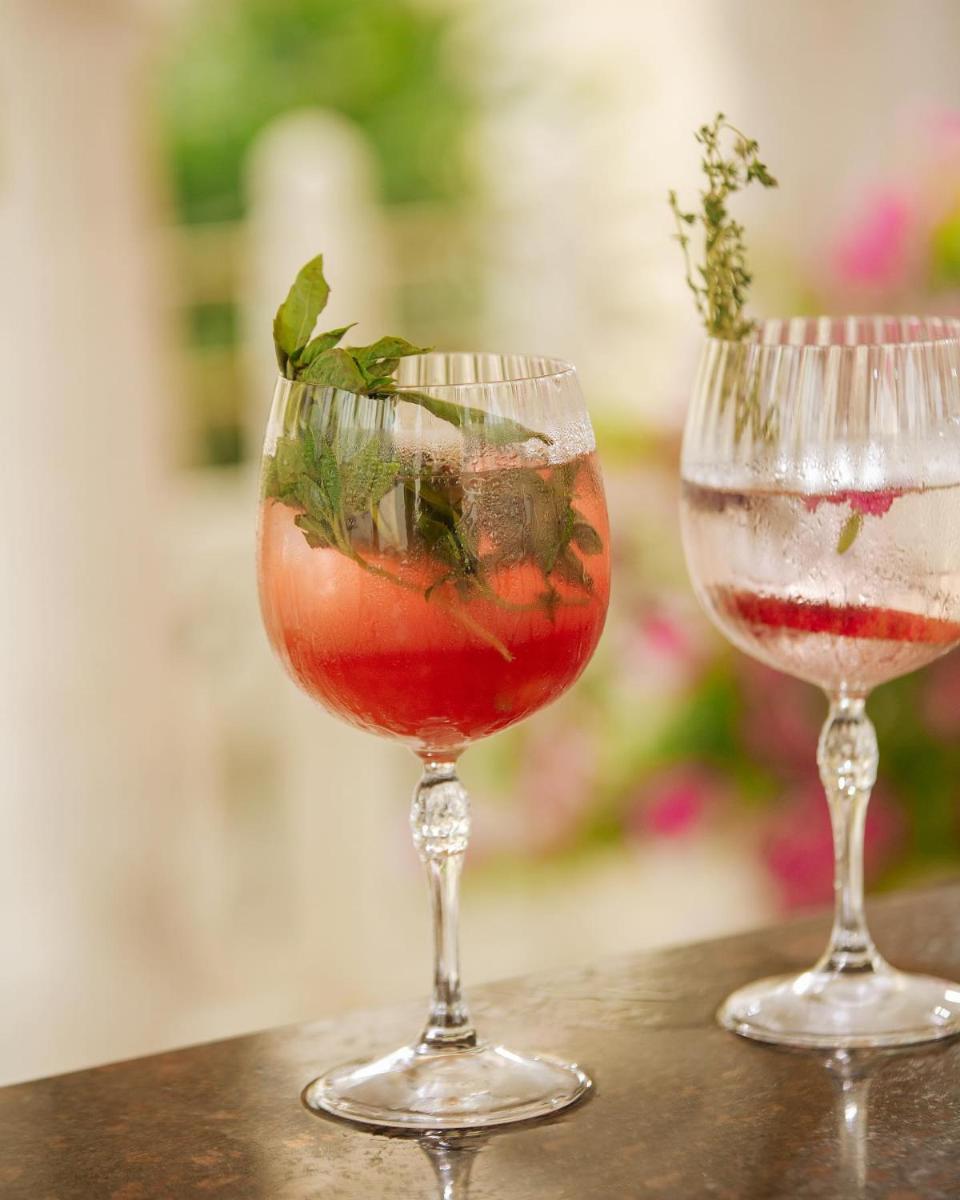 two wine glasses sitting on top of a table at Hyatt Regency Jaipur Mansarovar in Jaipur two wine glasses sitting on top of a table at Hyatt Regency Jaipur Mansarovar in Jaipur