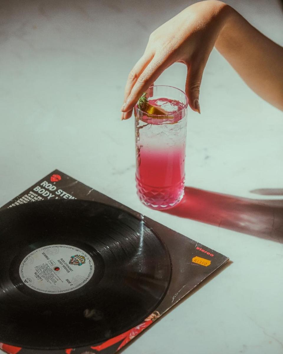 a person reaching for a drink on a record at Hyatt Regency Jaipur Mansarovar in Jaipur a person reaching for a drink on a record at Hyatt Regency Jaipur Mansarovar in Jaipur