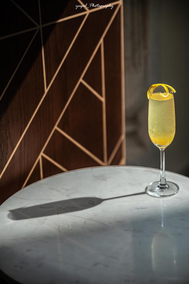 a glass of wine sitting on top of a table at Hyatt Regency Jaipur Mansarovar in Jaipur a glass of wine sitting on top of a table at Hyatt Regency Jaipur Mansarovar in Jaipur