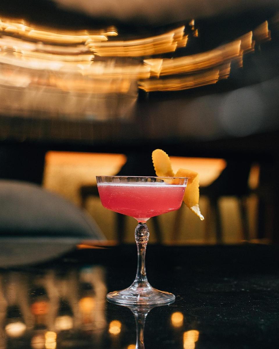 a drink in a martini glass sitting on a table at Hyatt Regency Jaipur Mansarovar in Jaipur a drink in a martini glass sitting on a table at Hyatt Regency Jaipur Mansarovar in Jaipur