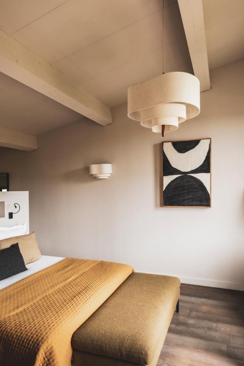 Un ou plusieurs lits dans un hébergement de l'établissement Les Lodges Sainte-Victoire Hotel & Spa