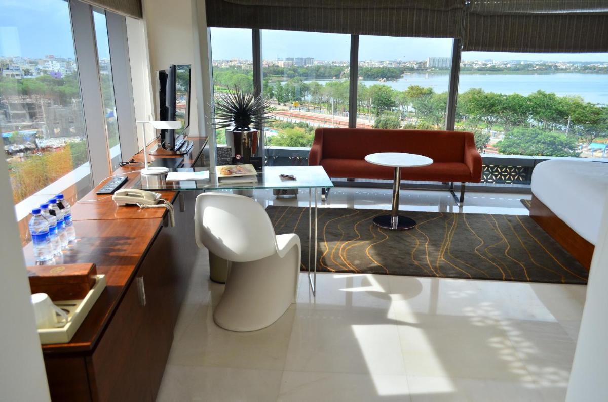 a living room with a view of the water at The Park Hyderabad, Banjara Hills near Hussain Sagar Lake in Hyderabad a living room with a view of the water at The Park Hyderabad, Banjara Hills near Hussain Sagar Lake in Hyderabad
