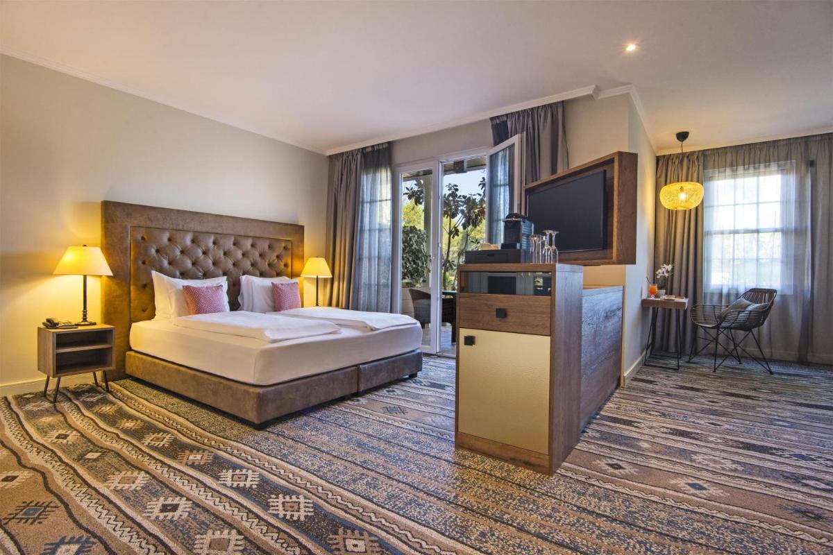 Cama o camas de una habitación en Lindner Hotel Mallorca Portals Nous, part of JdV by Hyatt