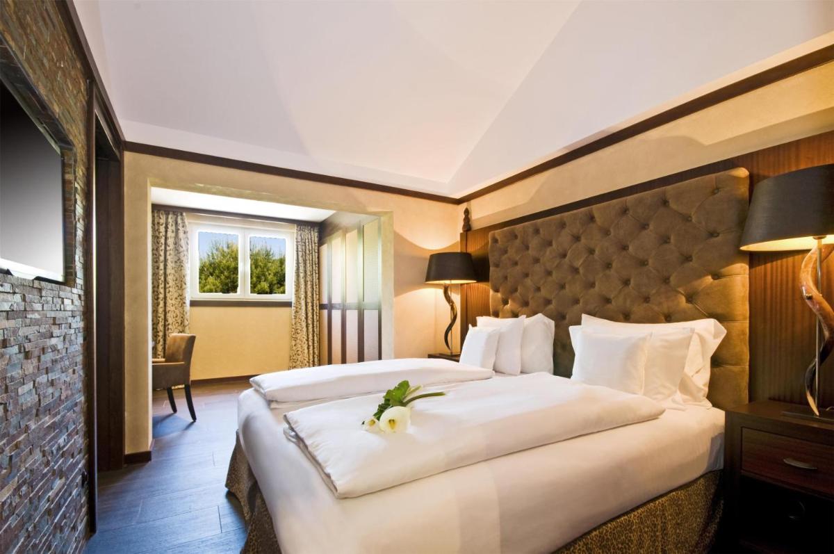 Cama o camas de una habitación en Lindner Hotel Mallorca Portals Nous, part of JdV by Hyatt