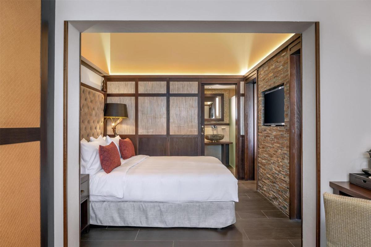 Cama o camas de una habitación en Lindner Hotel Mallorca Portals Nous, part of JdV by Hyatt
