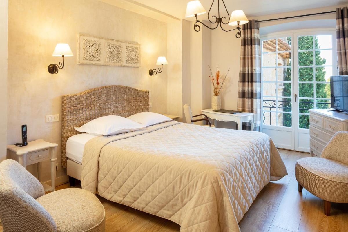 Un ou plusieurs lits dans un hébergement de l'établissement La Bastide De Tourtour Hotel & Spa