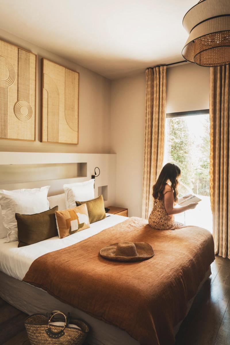 Un ou plusieurs lits dans un hébergement de l'établissement Les Lodges Sainte-Victoire Hotel & Spa