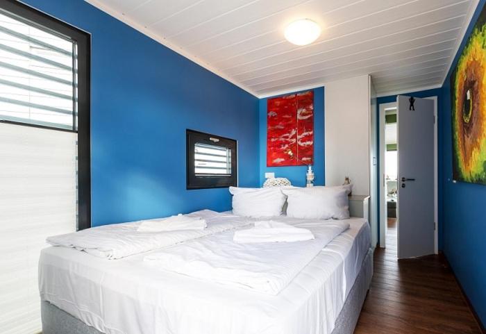 Ein Bett oder Betten in einem Zimmer der Unterkunft Schwimmende Häuser im BALTIC SEA RESORT