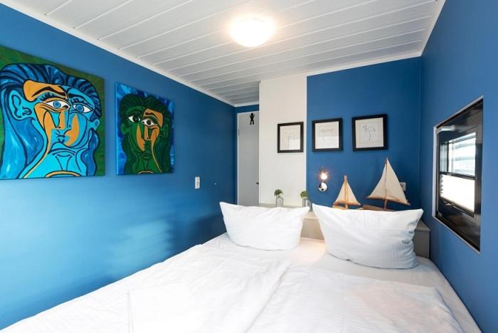 Ein Bett oder Betten in einem Zimmer der Unterkunft Schwimmende Häuser im BALTIC SEA RESORT