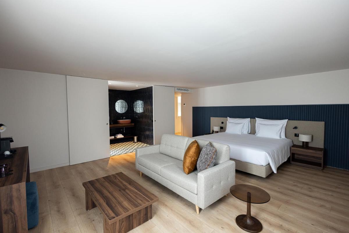 Uma cama ou camas num quarto em The Lince Braga