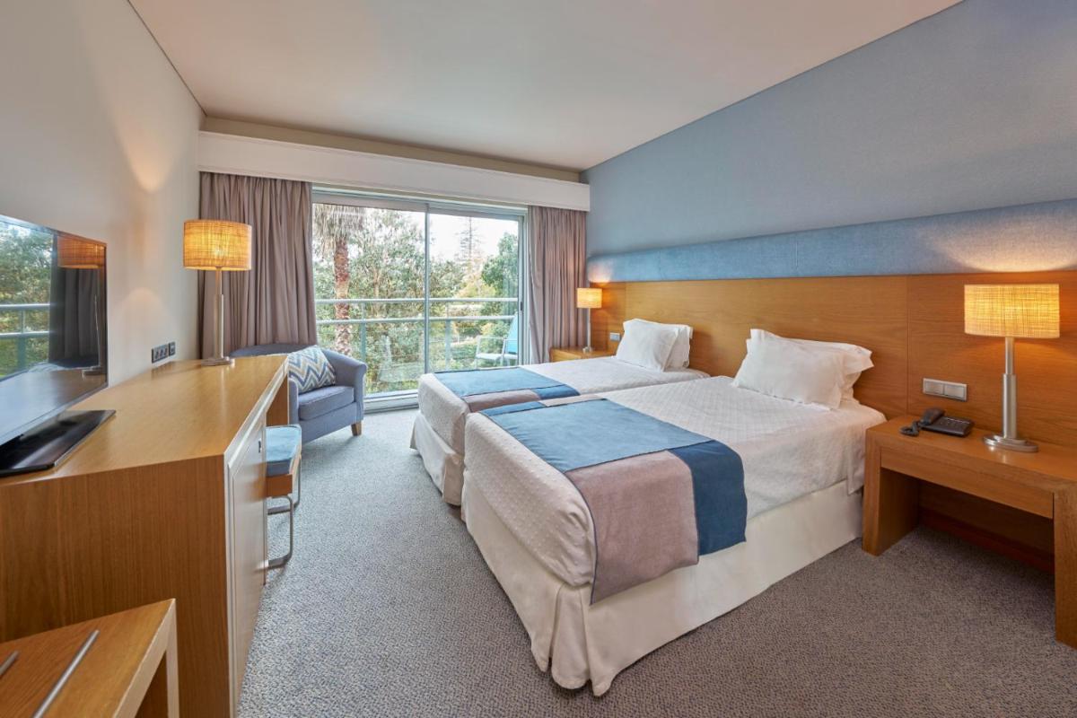 Uma cama ou camas num quarto em Hotel Do Caracol