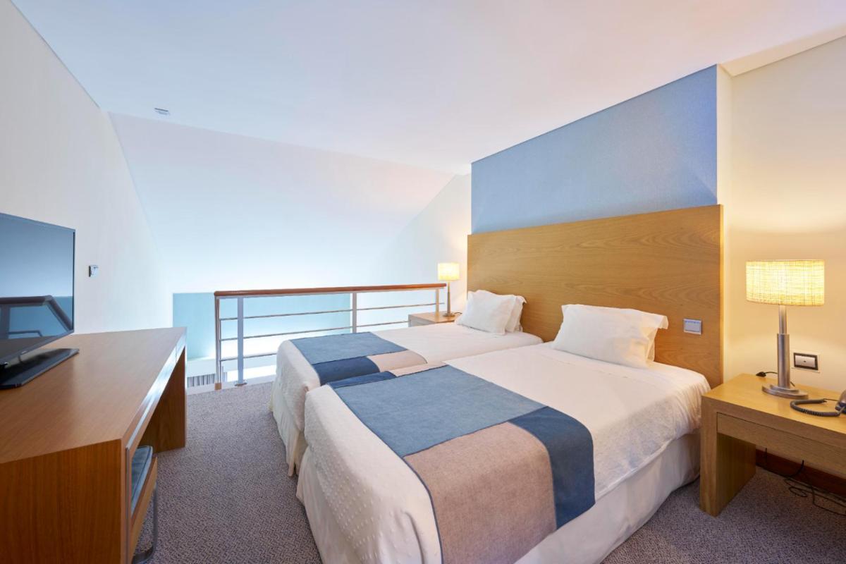 Uma cama ou camas num quarto em Hotel Do Caracol