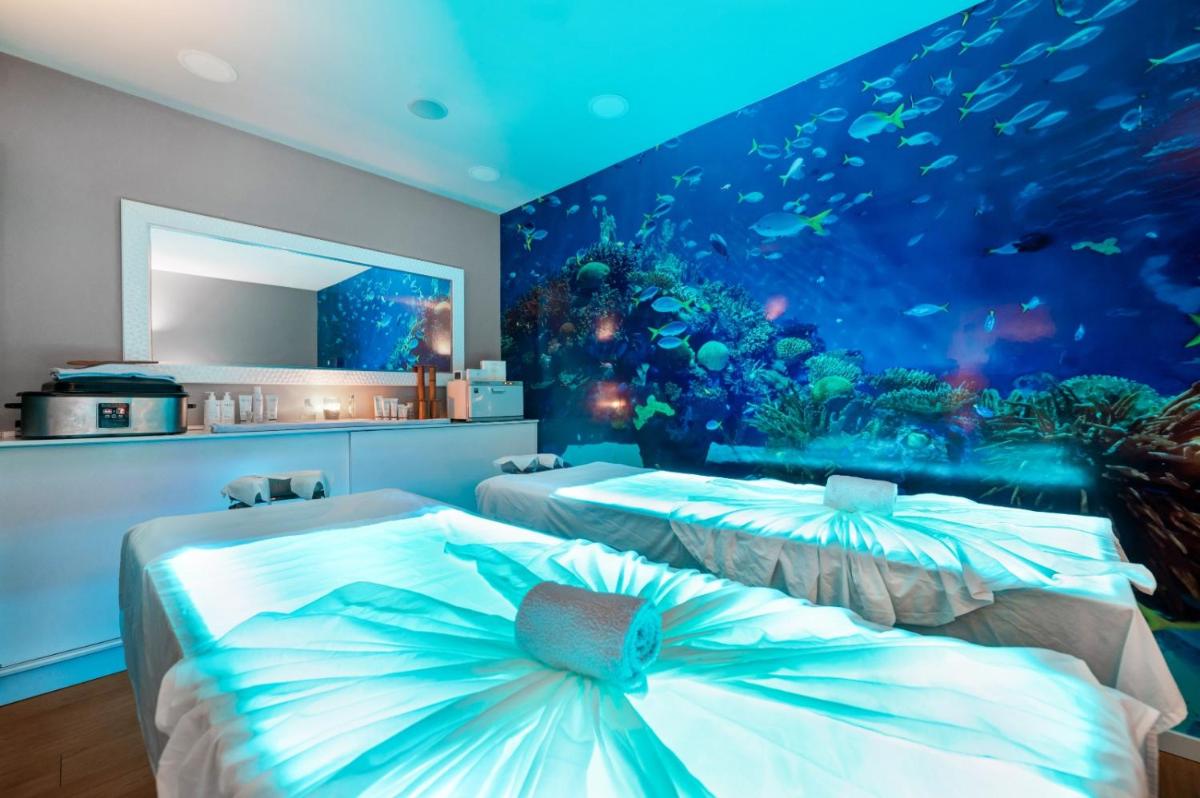 Uma cama ou camas num quarto em Hotel Do Caracol
