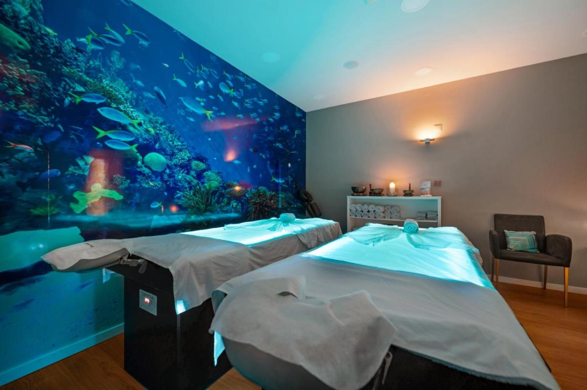 Uma cama ou camas num quarto em Hotel Do Caracol