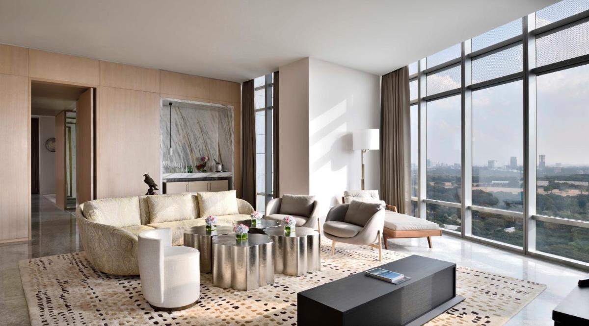 a living room with a couch and a table at Four Seasons Hotel Bengaluru at Embassy ONE in Bengaluru a living room with a couch and a table at Four Seasons Hotel Bengaluru at Embassy ONE in Bengaluru
