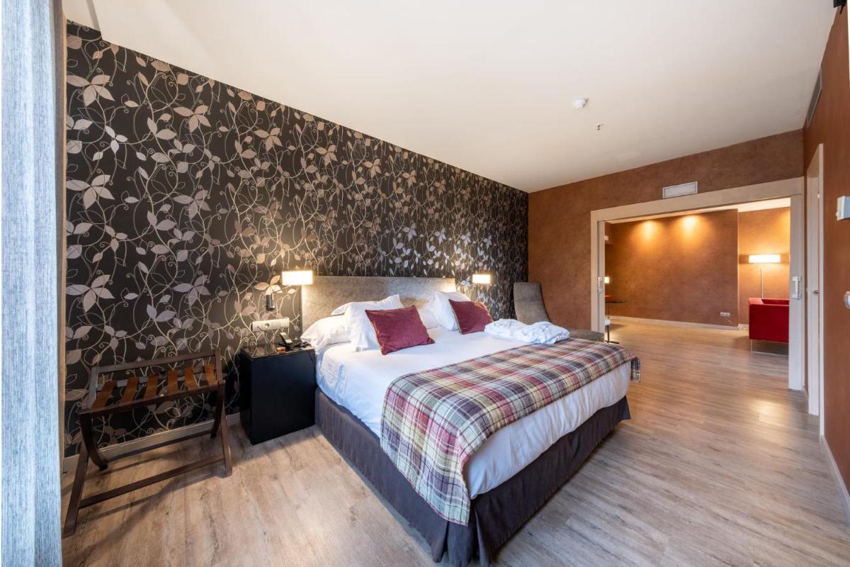 Cama o camas de una habitación en Castilla Termal Burgo de Osma