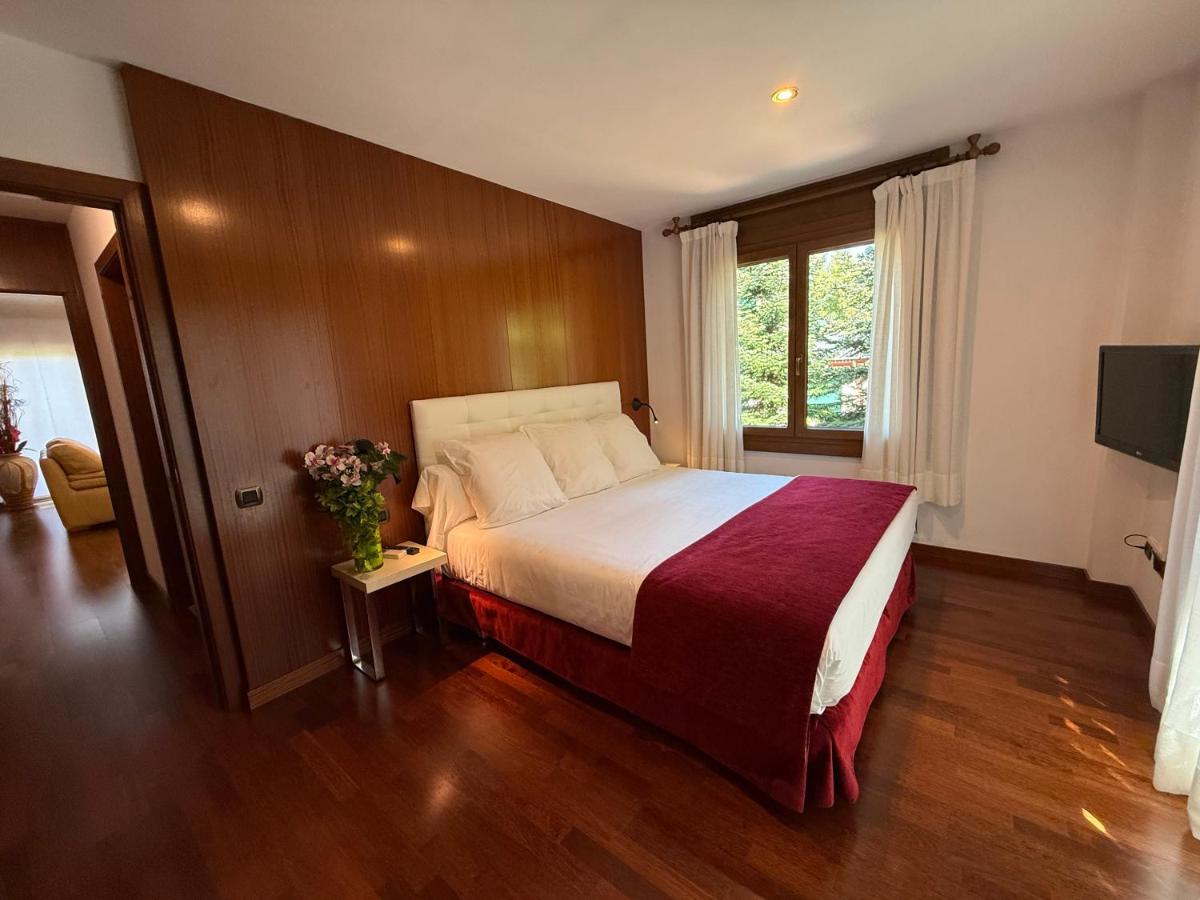 Cama o camas de una habitación en Hotel Del Lago