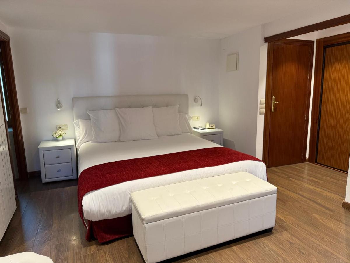 Cama o camas de una habitación en Hotel Del Lago