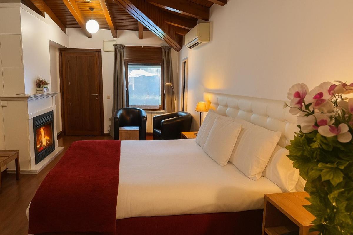 Cama o camas de una habitación en Hotel Del Lago