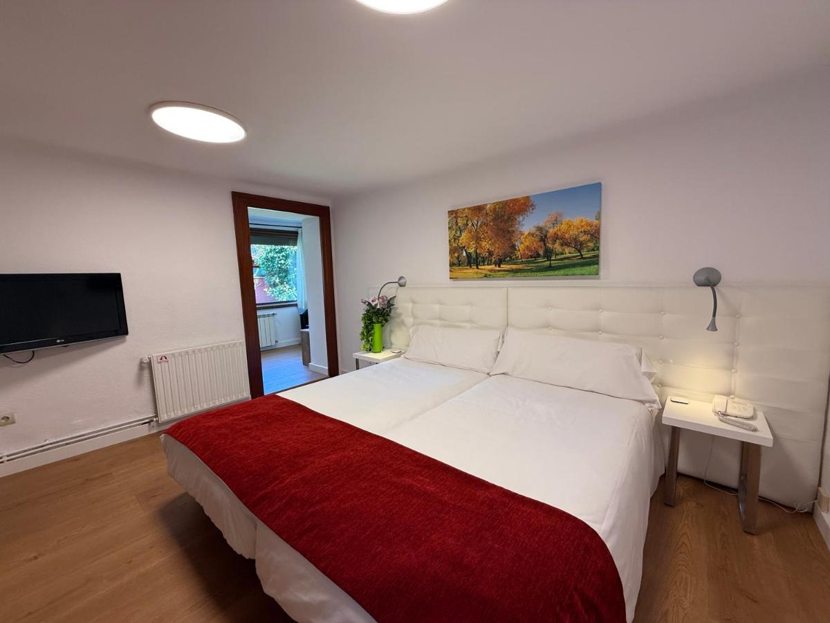 Cama o camas de una habitación en Hotel Del Lago