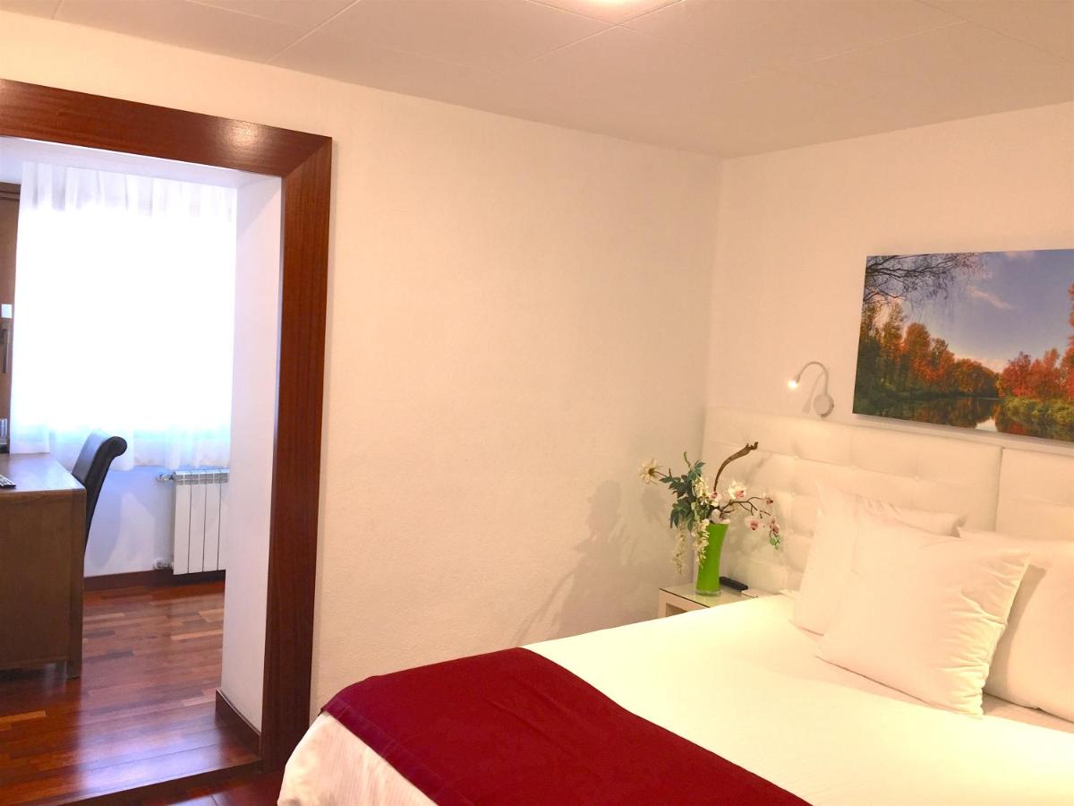 Cama o camas de una habitación en Hotel Del Lago