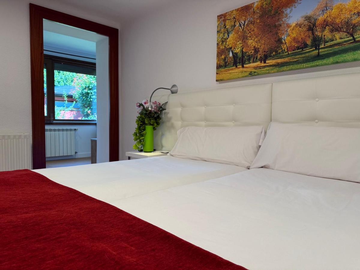Cama o camas de una habitación en Hotel Del Lago