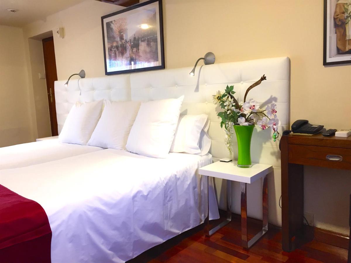 Cama o camas de una habitación en Hotel Del Lago