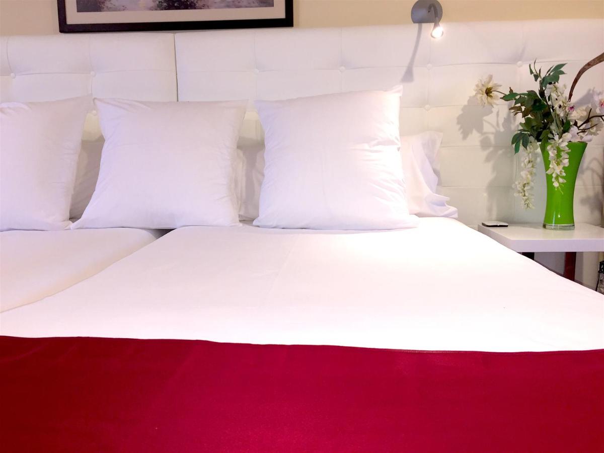 Cama o camas de una habitación en Hotel Del Lago