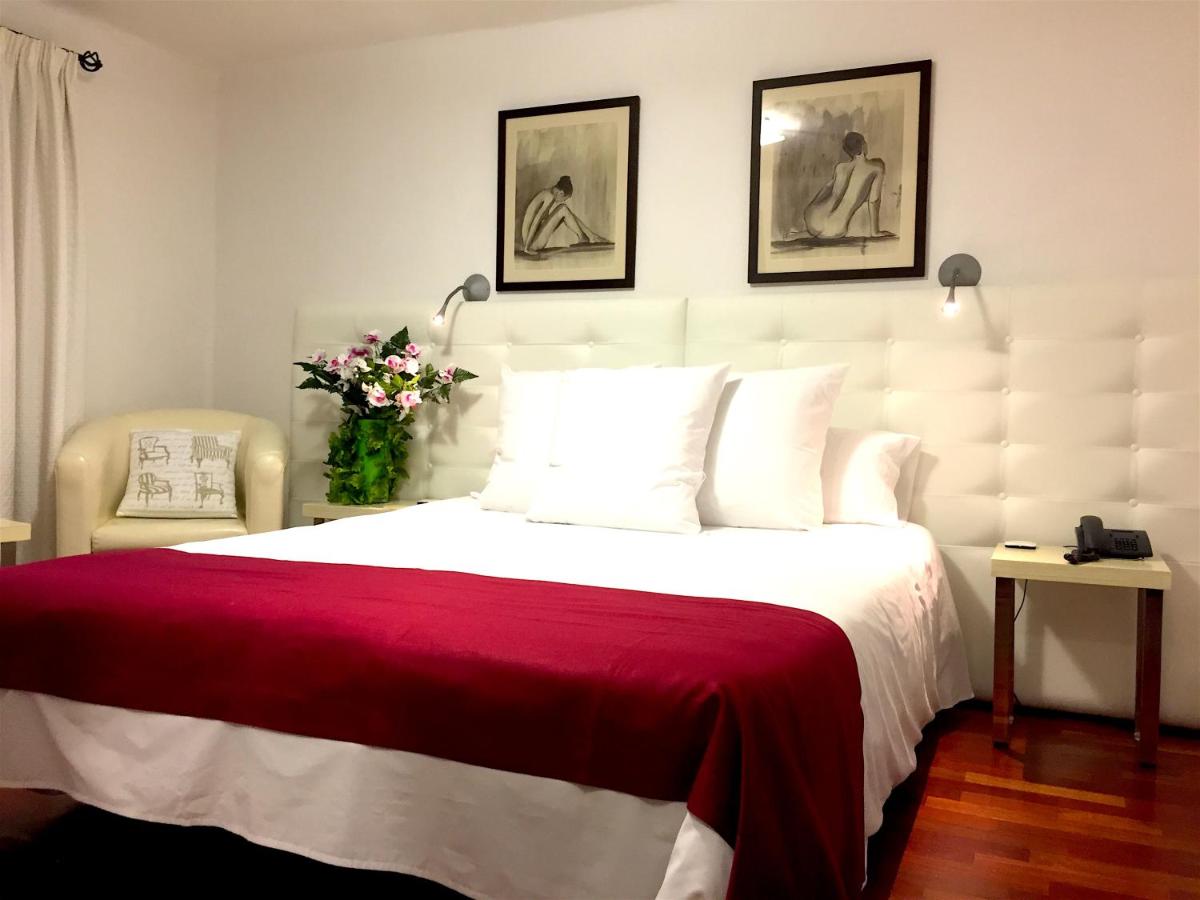 Cama o camas de una habitación en Hotel Del Lago