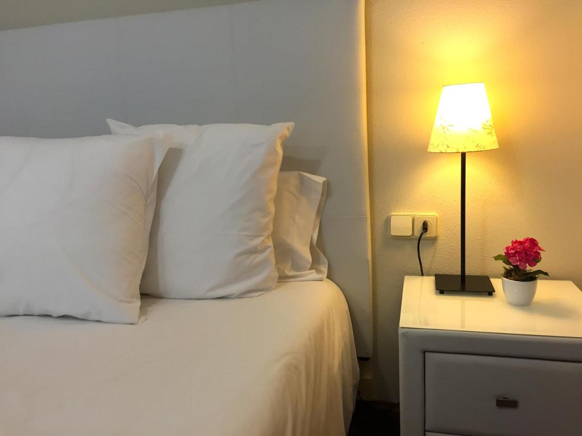 Cama o camas de una habitación en Hotel Del Lago