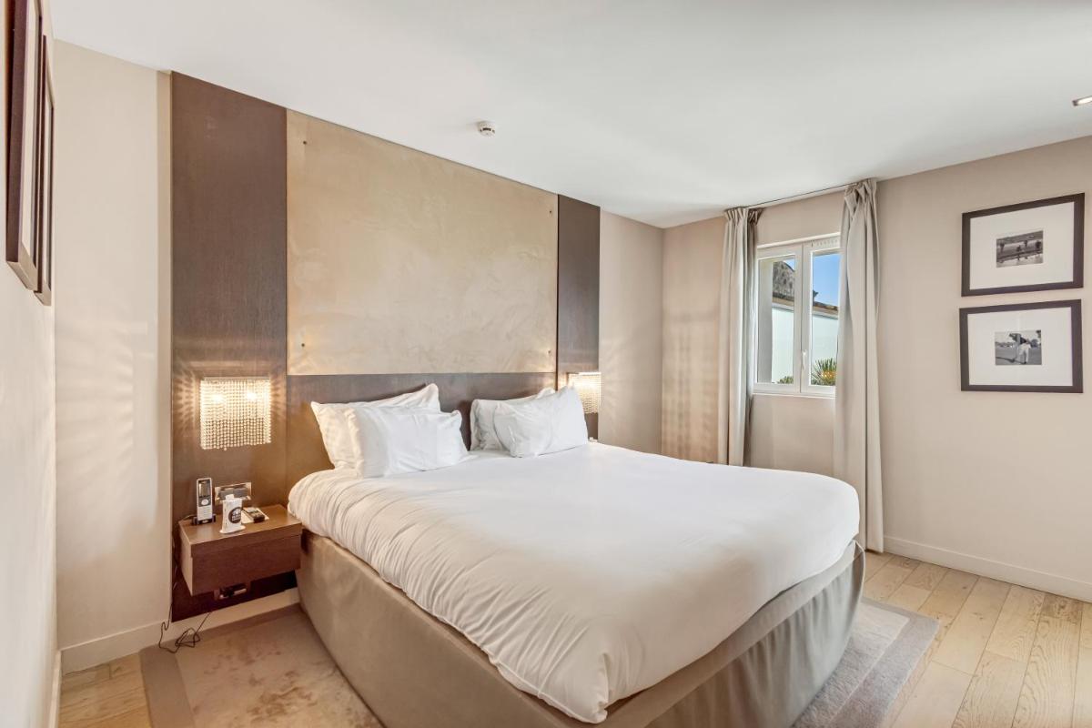 Un ou plusieurs lits dans un hébergement de l'établissement Royal Mougins Golf, Hotel & Spa de Luxe